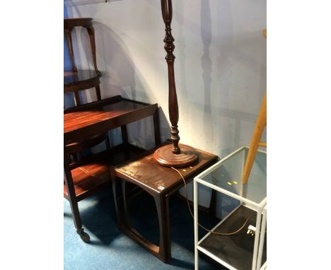 A nest of tables and a standard lamp