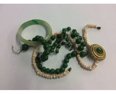 A jade bangle, necklace etc.