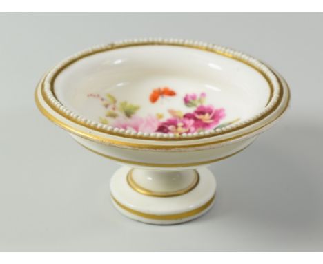 A RARE NANTGARW PORCELAIN MINIATURE TAZZA, circa 1820, the bowl of shallow circular form raised over a turned foot and with e