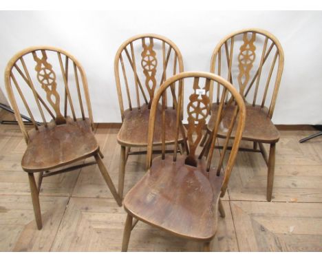 Set of four Ercol style elm and beech wheel and stick back kitchen chairs 