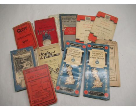 A selection of early to mid 20thC touring, motoring and ordnance survey maps with some other related books 