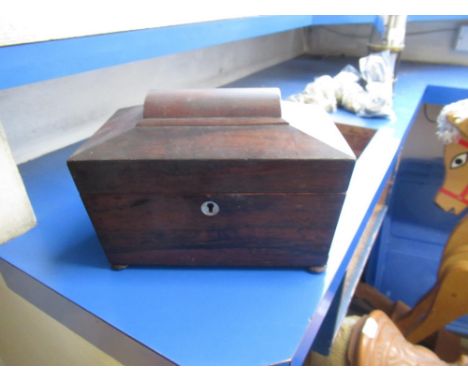 C19th rosewood sarcophagus shaped tea caddy, with hinged top and two lift out internal lids on bun feet H16cm W22.5cm D13.5cm