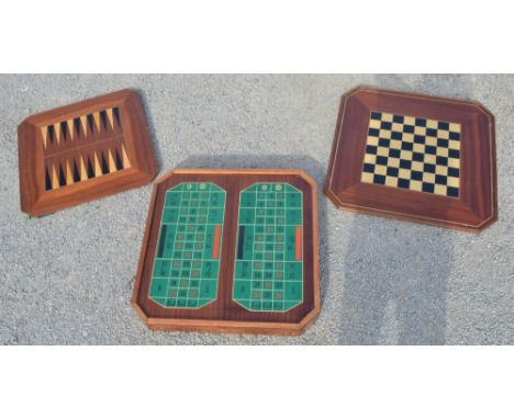 Games compendium table, inlaid lid with chessboard reverse, inner with backgammon board revealing a roulette wheel, 74cm x 74