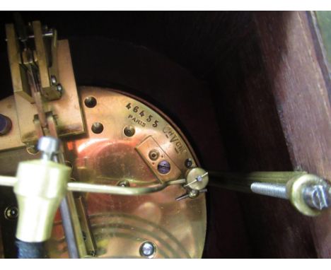 Edwardian inlaid mahogany arched top mantel clock with white Roman dial and brass handles and feet, twin train French brass m