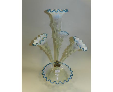 A Victorian glass four trumpet epergne, blue glass with opaline borders