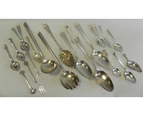 A pair of silver salad servers together with a collection of various silver spoons, a silver caddy spoon, etc.