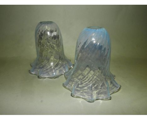 A pair of vaseline glass lighting shades