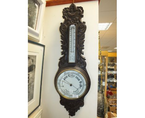 A Victorian oak stained barometer