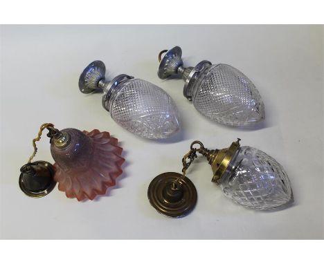 Glass light fittings, to include a pair of pineapple shaped lamps, a cranberry glass lamp and another, (4)