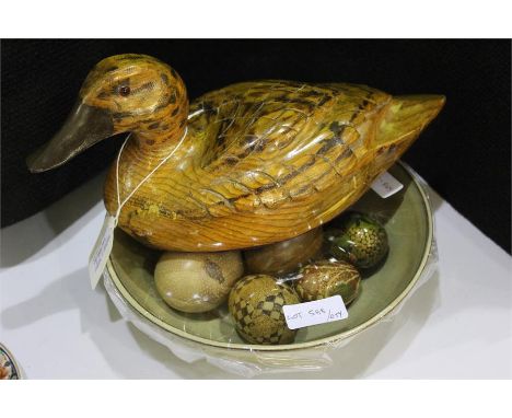 Eight decorative eggs housed within a ceramic bowl, carved wooden duck, (qty)