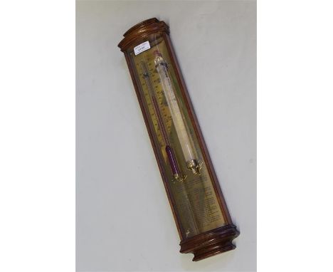 Storm glass/barometer, with engraved brass back plate, the mahogany frame with curved glass front panel, 48.5cm high