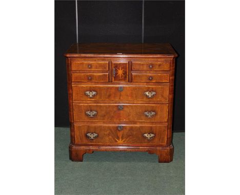 Reproduction walnut and marquetry inlaid media unit, in the form of a 17th century chest, with hinged lid above a frieze draw