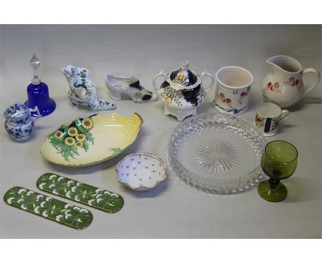 Mixed ceramics and glass, to include a cut glass bowl, a 19th century teapot, a glass bell, porcelain shoes, Carlton ware. Li