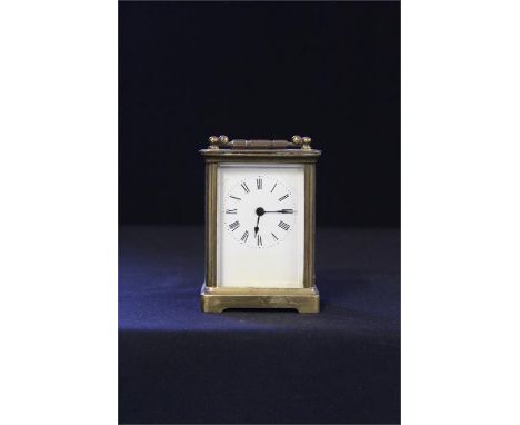 French gilt brass carriage clock, the five glass case with a white enamel dial and Roman hours, the case 13.5cm high