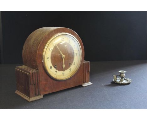 Oak cased mantel clock, with a silvered chapter ring, together with a chamber stick, (2)