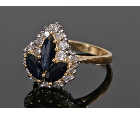 18 carat gold, sapphire and diamond ring, with three sapphires and a diamond surround forming a leaf design, ring size K