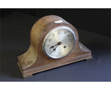 Oak cased Napoleon hat mantel clock, the silvered dial with Arabic numerals, striking movement, 35.5cm wide, 22.5cm high