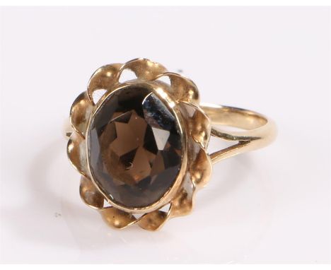 9 carat gold ring, set with a quartz to the head and a wavy edge, ring size K