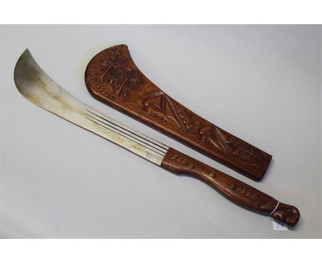 St Lucia souvenir machete, the wooden scabbard carved with palm trees and sailing vessels, the carved handle dated 1949-1953,