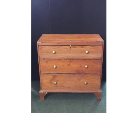 Pine chest of three long drawers, with brass mounted corners and brass handles, on bracket feet, 83.5cm wide