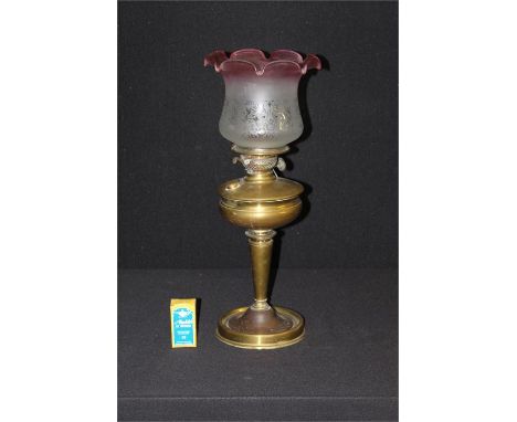 Oil lamp with frosted ruby and clear glass shade, copper and brass lower section