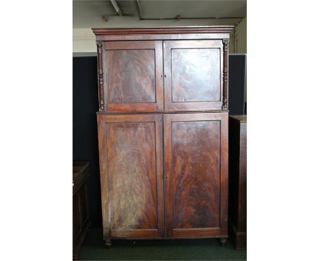 Victorian mahogany cupboard, the stepped pediment above two panelled cupboard doors with scroll and acanthus leaf carved half