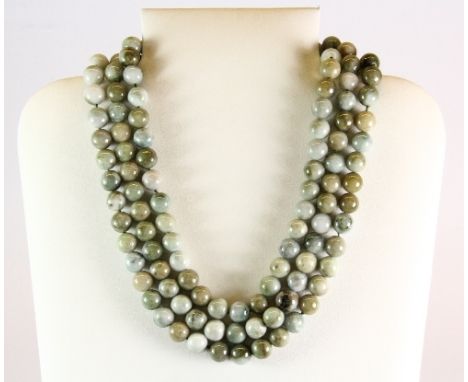 A 3 row necklace of jade / hardstone beads