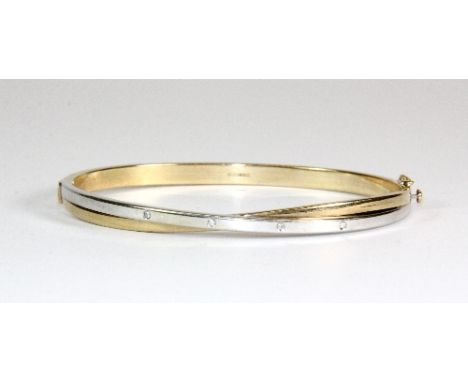 A 9ct gold and diamond 2 colour bangle