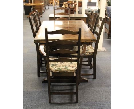 An Ercol extending oak dining table and 6 chairs