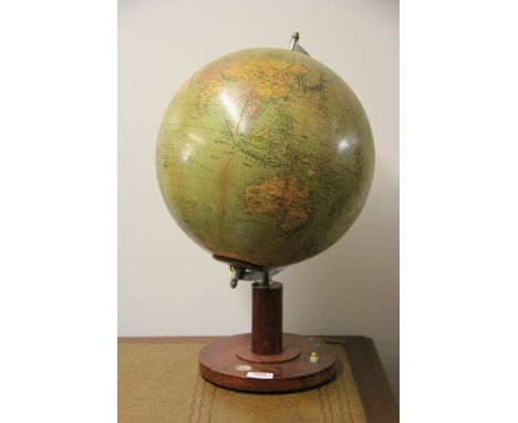 A vintage glass globe on a mahogany stand, H 51cm