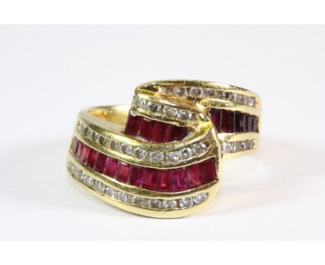 A lovely yellow metal (tested 18ct gold) ruby and diamond ring (P approx) (but with grip balls inserted)