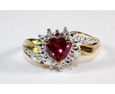 A 10ct gold diamond and heart shaped synthetic ruby ring (O)