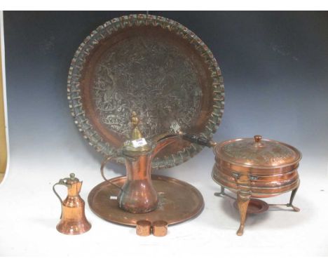 A quantity of copper and metal wares to include a large circular tray decorated with an Eastern hunting scene, a warming pan,
