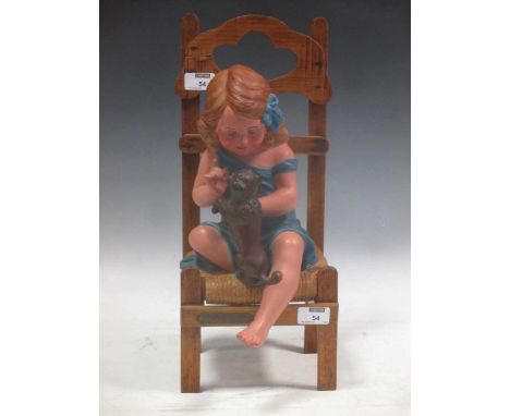 An early 20th century figure, girl on chair with dog , entitled Fais le beau by A de Ranieri, with impressed mark and model n