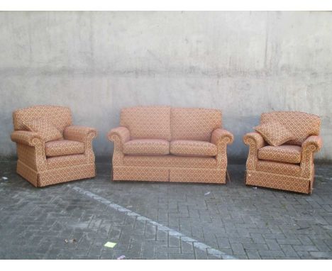 A modern three-piece suite upholstered in red and gold, sofa - 150cm wide