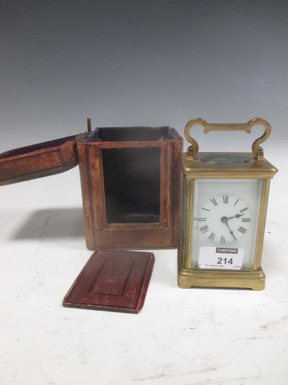 A brass carriage clock with original travelling case and key in ...