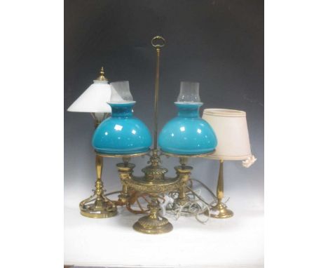 An Empire style brass lamp en buillote, together with two further brass table lamps