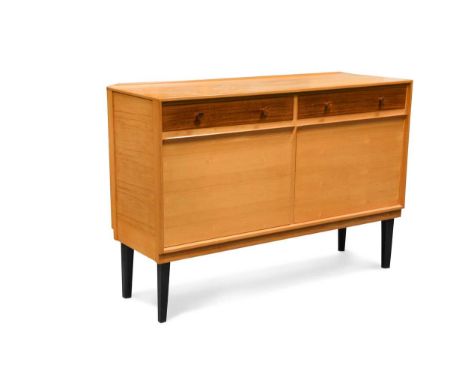 probably made by G. W. Evans, with two frieze drawers over two fall-front cupboard doors and raised on ebonised tapering legs