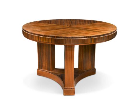 the circular top with sectioned Kingwood, the skirt with Maccasar Kingwood and ebony, raised on three fluted columns to a tri