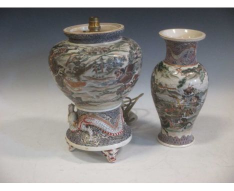 Two Japanese Meiji period satsuma vases decorated with elaborate battle scenes and dragons, signed to base, the larger 42cm t