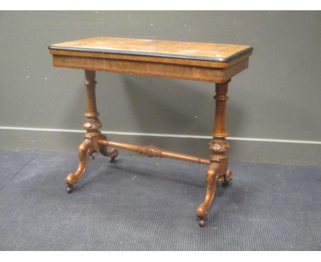 A Victorian walnut rectangular card table, on ceramic casters, 72 x 87 x 47cm