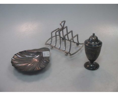 An 18th century silver spice caster, together with a Victorian silver shell dish and a silver toast rack by George Unite, 5oz
