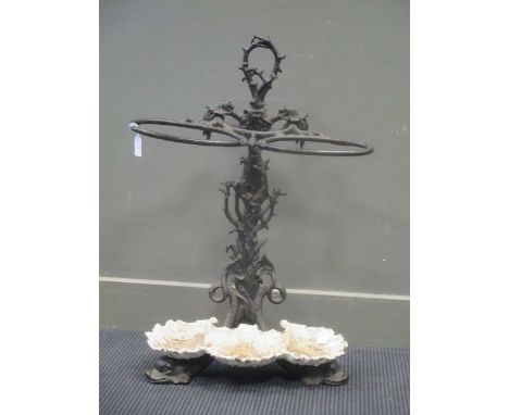 A Victorian black painted cast iron stick stand, with marine themed decoration 79cm high