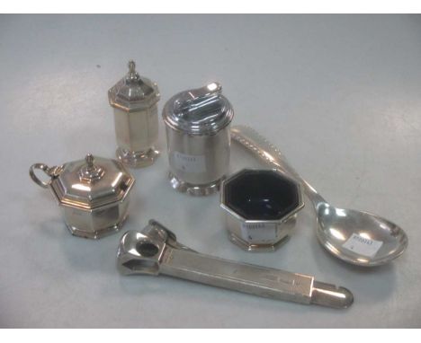 A silver mounted table cigar cutter, a silver mounted table cigar lighter, a three-piece silver condiment set and a silver ta