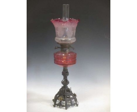 A Victorian cranberry glass etched oil lamp, total height 70cm