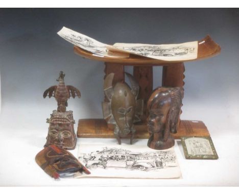 A collection of West African tribal artefacts, including full costume, bronzes, a stool etc.