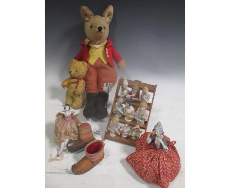 A collection of bone china or porcelain pin cushion dolls; a toy fox doll and a miniature teddy bear