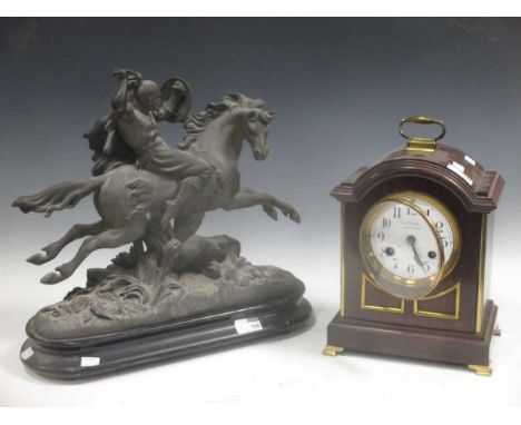 George III style mahogany bracket clock, dial signed 'Frank Phillips', and a spelter figure of a Moghul style warrior on hors