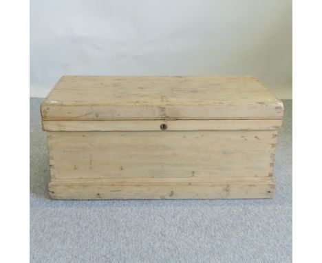 An antique pine trunk, with a hinged lid, 100cm