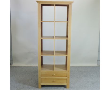 A modern light oak shelf unit with drawers beneath, 72cm
